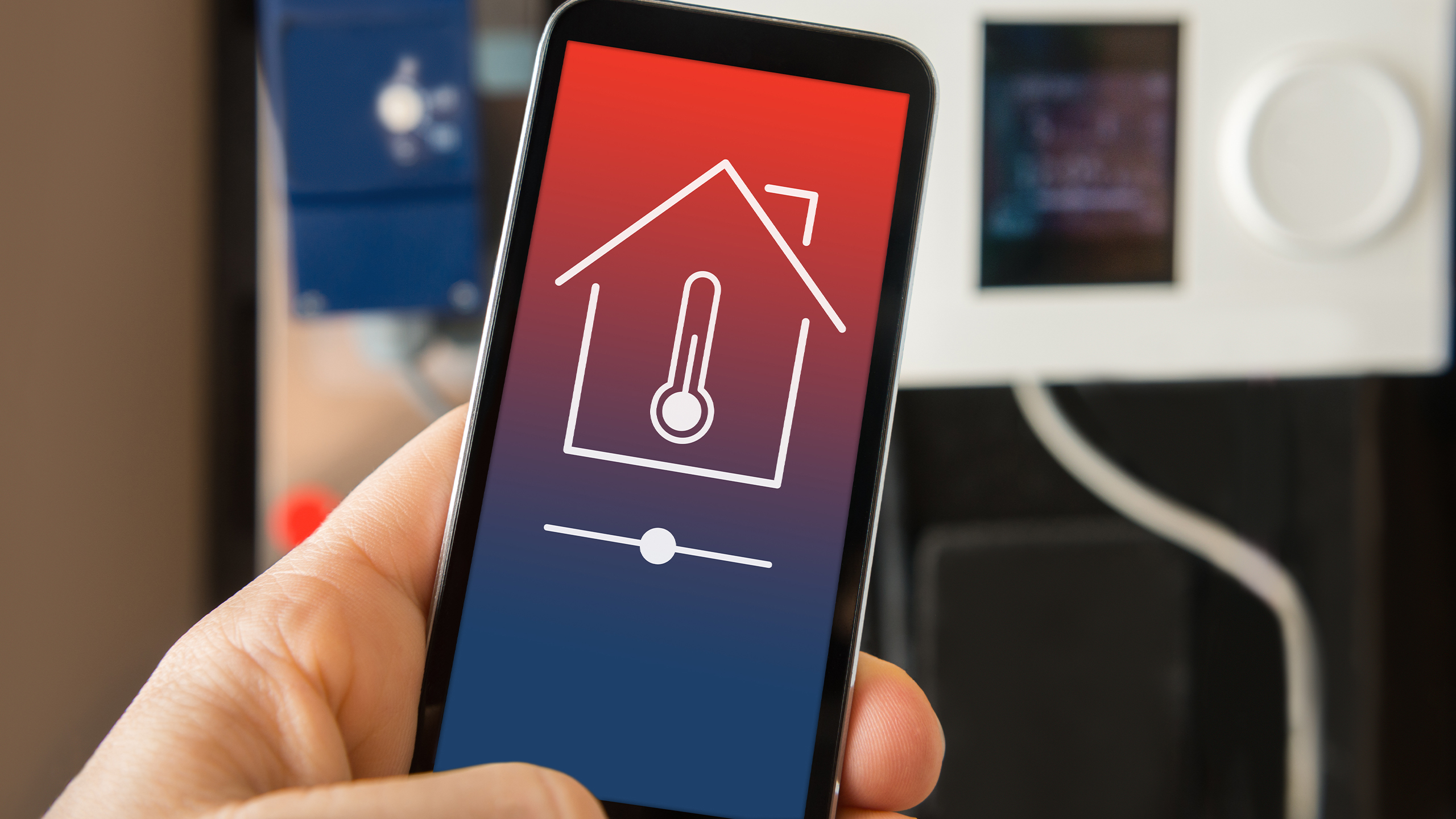 Preparing Your Home HVAC System for Winter Smartphone displaying home heating controls for an HVAC system